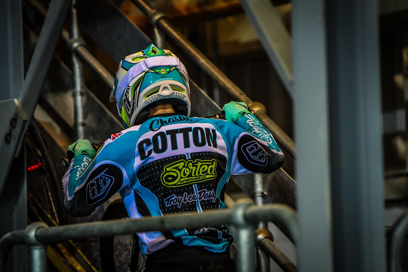 The back of Charlie's aqua Sorted jersey with COTTON across the shoulders