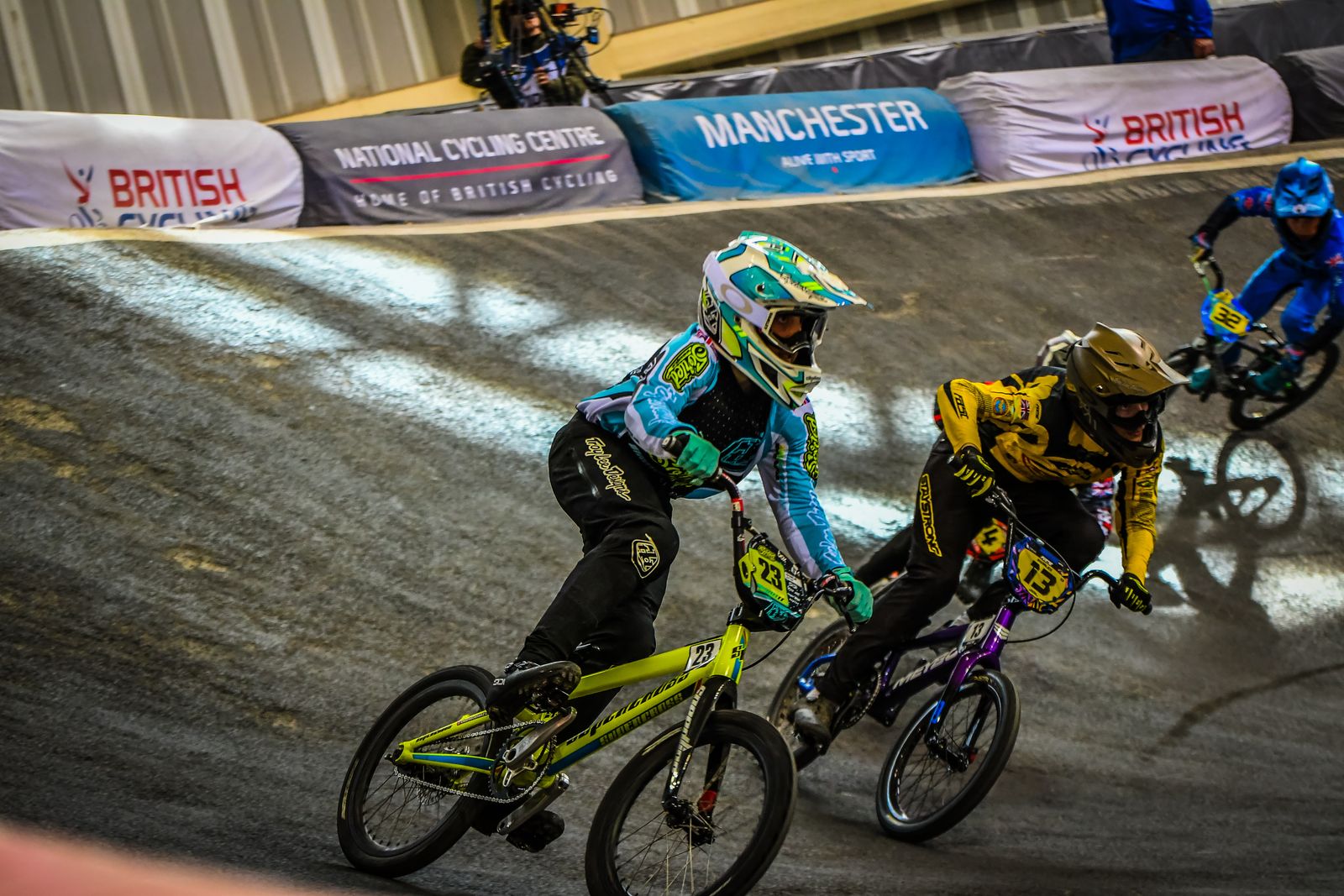 Charlie racing shoulder to shoulder with a rival through a berm